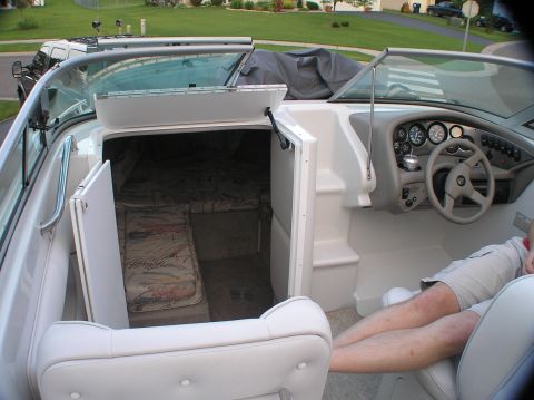 1997 Crownline 266 CCR - Interior of a boat, including the helm and cabin area.