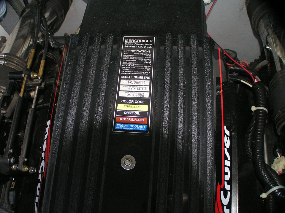 Black MerCruiser 454 Magnum marine engine cover with spec and serial number label