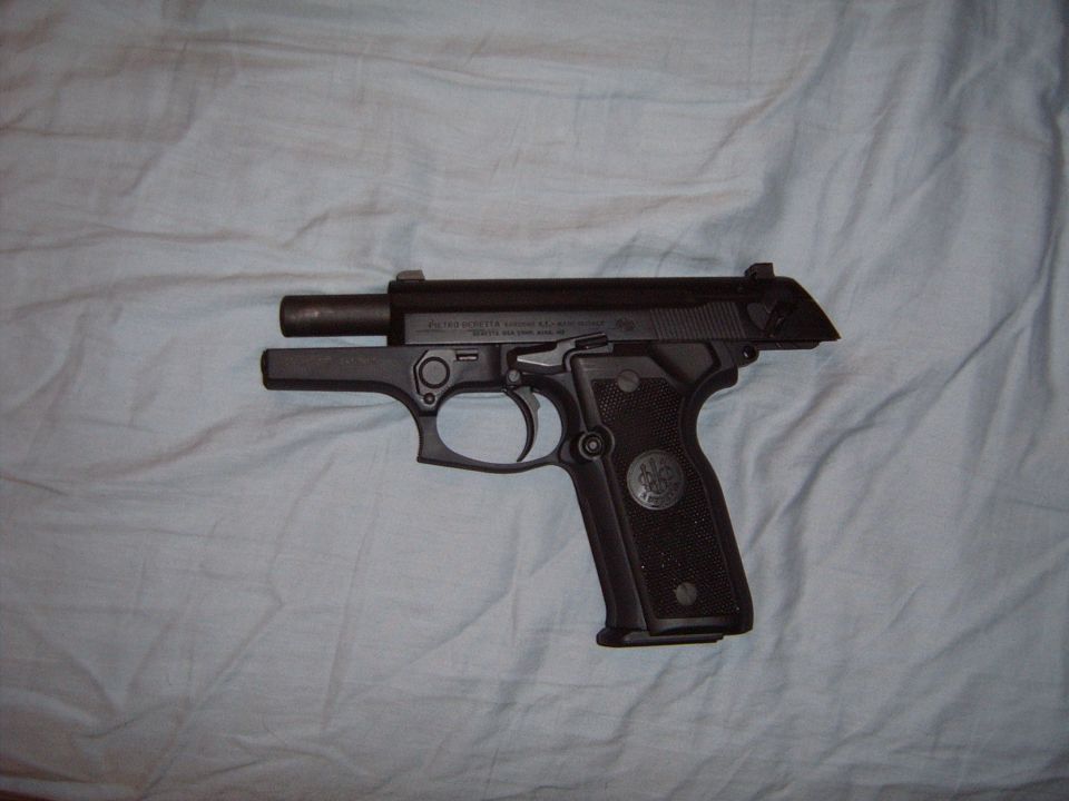 Black semi-automatic pistol with visible text on slide