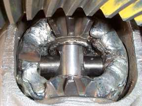 1971 Ford Bronco - Damaged differential gears are shown in this close-up view, with a SuperMotors logo visible.