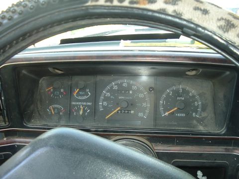 1989 Ford Bronco - The interior view of a 1989 Ford Bronco shows its dashboard gauges, including the speedometer and tachometer.