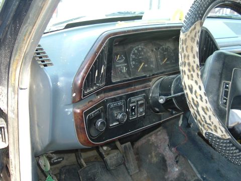 1989 Ford Bronco - Interior view of a 1989 Ford Bronco, the dashboard, steering wheel, and pedals.