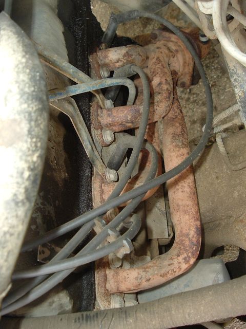 1989 Ford Bronco - Exhaust manifold and spark plug wires visible in engine bay.