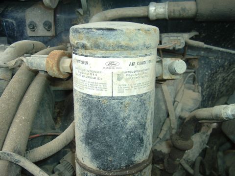 1989 Ford Bronco - A Ford air conditioner receiver-drier is visible in the engine bay, with a label indicating it is a Ford part.