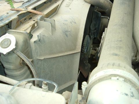 1989 Ford Bronco - Close-up of a vehicle's radiator fan and shroud, part of the engine cooling system.