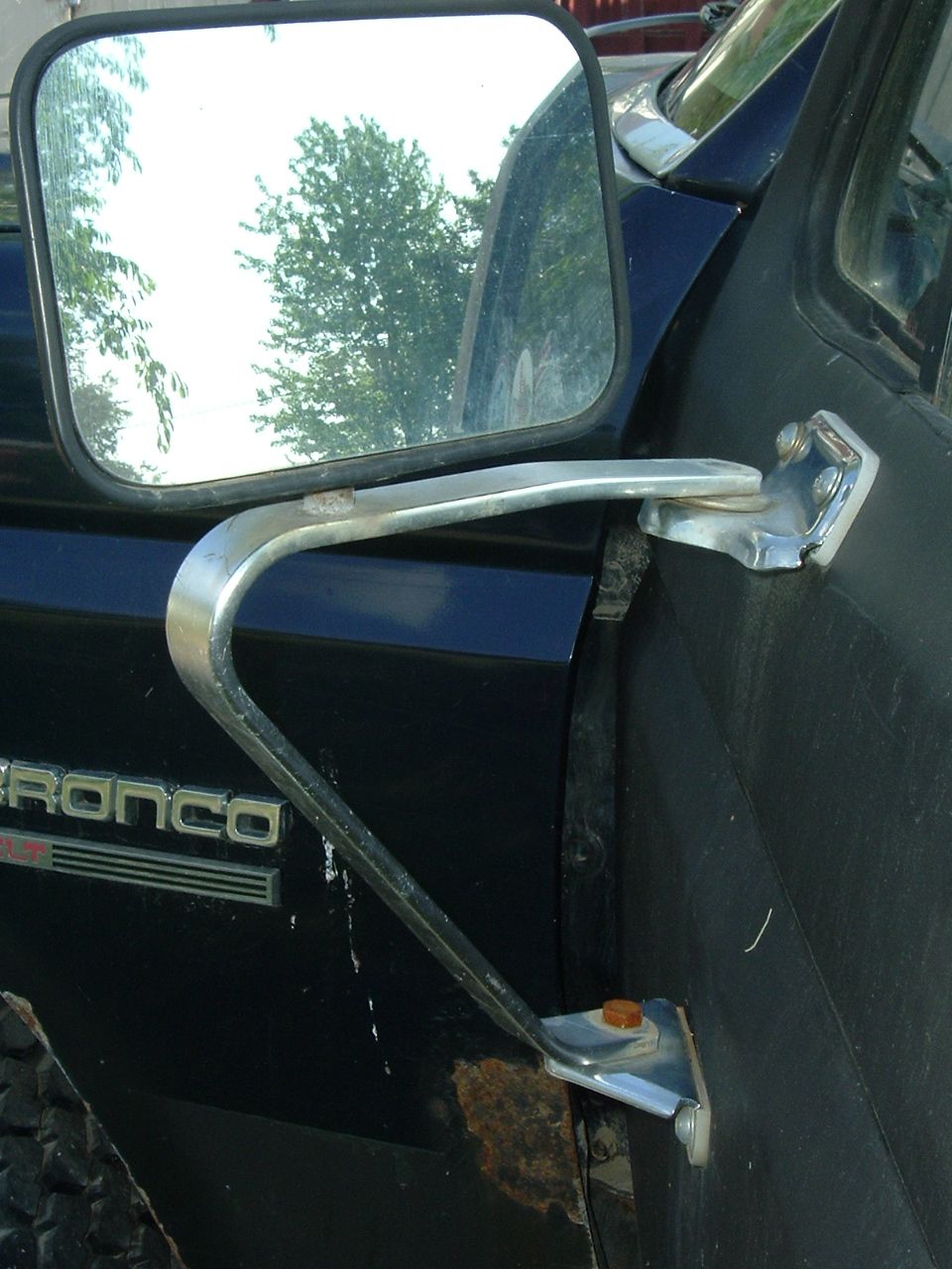 1989 Ford Bronco side mirror mount and door panel with Bronco badging