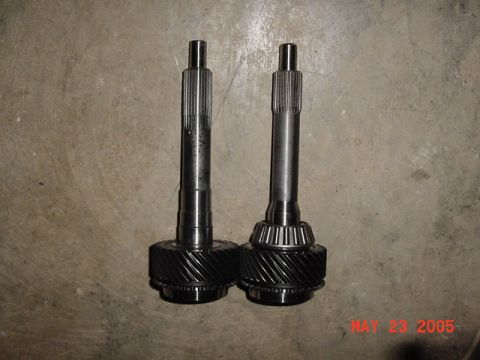 2003 Ford Mustang - Two transmission input shafts are shown, one a conical bearing assembly. The image also contains a watermark from Supermotors.net dated May…