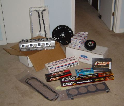 1986 Ford Bronco - Various engine components, including cylinder heads, gaskets, and performance parts from Crane Cams and Ford Racing.