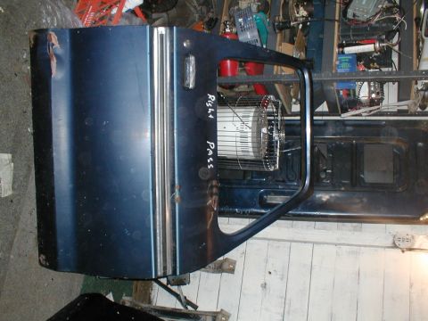 1979 Ford Bronco - A detached vehicle door is shown, with handwritten text indicating it is for the passenger side.