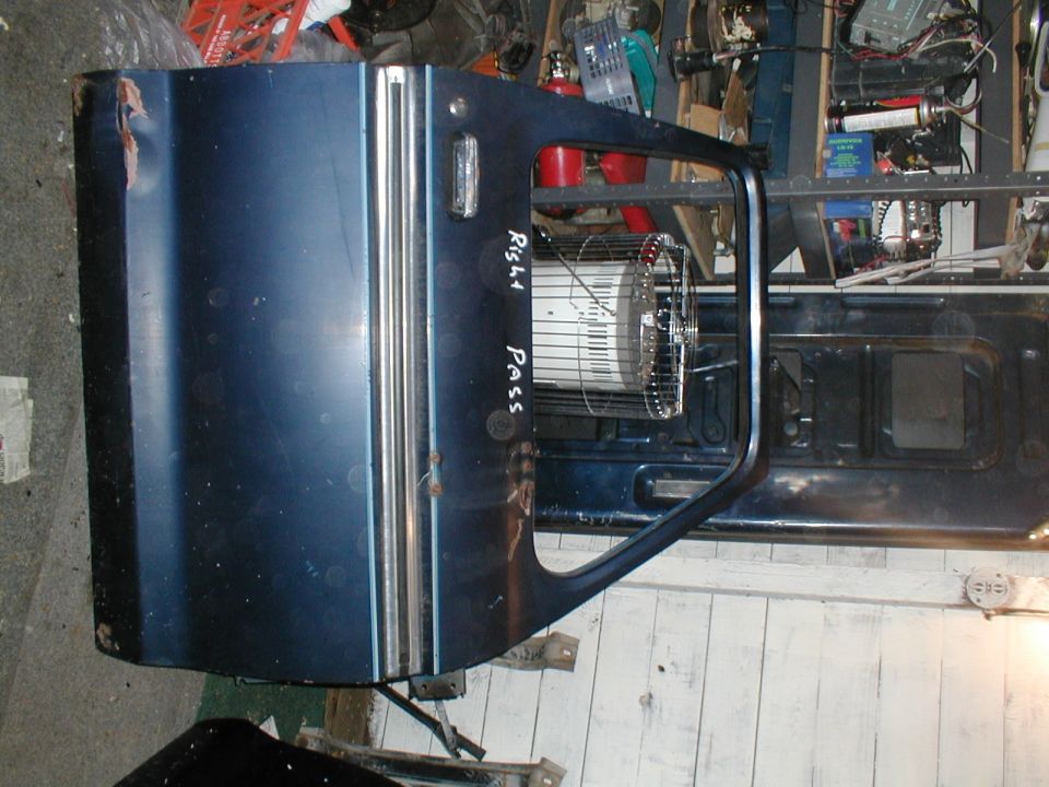 Blue vehicle door with chrome trim and a handwritten 'Right Pass' label. A fan is visible inside