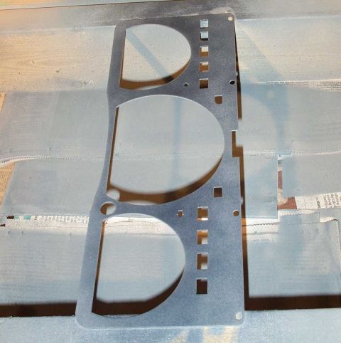 1998 Ford Crown Victoria - A custom gauge cluster trim panel is shown, likely undergoing modification or painting.