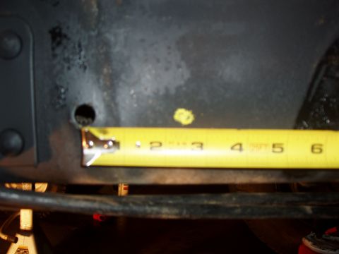 1994 Ford Bronco - A tape measure is used to measure a component, showing about 3.5 inches.