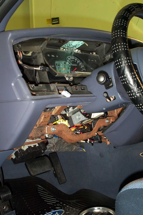 1998 Ford Crown Victoria - Interior view of a 1998 Ford Crown Victoria showing the disassembled dashboard and exposed wiring beneath the instrument panel.