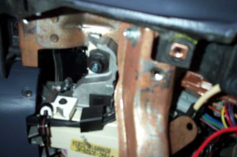 1998 Ford Crown Victoria - The next two pics are blurry but show the transmission range indicator cable. It must be unhooked in order to remove the gauge cluster.