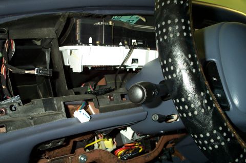 1998 Ford Crown Victoria - Exposed dashboard wiring and gauge cluster during repair or modification.