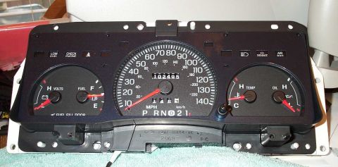 1998 Ford Crown Victoria - A car's instrument cluster is shown, displaying various gauges and indicators.