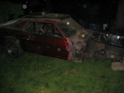 1978 Ford Bronco - This car appears to be in a state of disrepair, with its front end completely removed and the body showing significant wear.