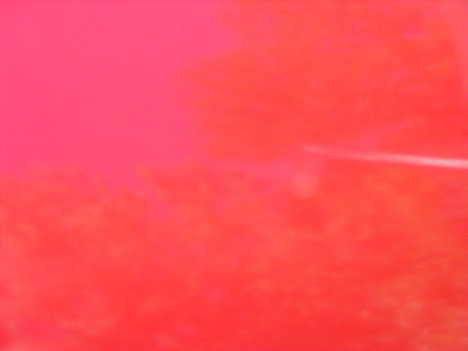 Red car with a white stripe on the side