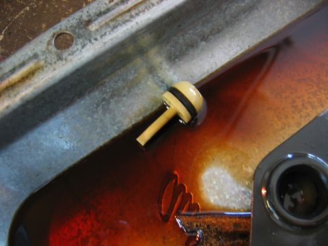 1985 Ford Crown Victoria LTD - Transmission fluid level check showing dipstick submerged in pan.