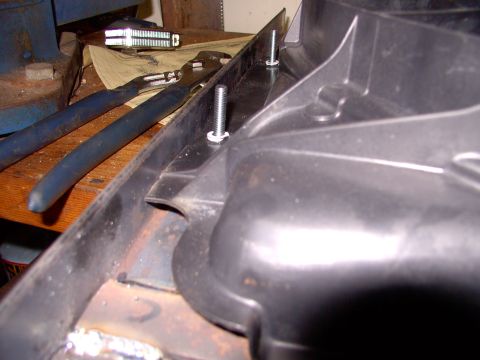 1986 Ford Bronco - Another trial fit of the fan shroud and mark the next hole for drilling. The studs lined up with the stock Taurus shroud holes very well in…