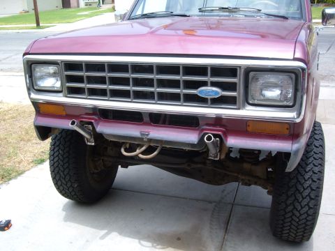 1985 Ford Bronco II - Front view of a maroon 1985 Ford Bronco II, showing its grille and headlights.