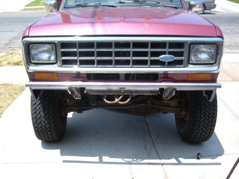 1985 Ford Bronco II - Front view of a 1985 Ford Bronco II, its chrome grille and bumper.