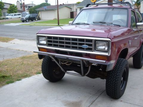 1985 Ford Bronco II - This modified Ford Bronco II is parked in front of a suburban house.