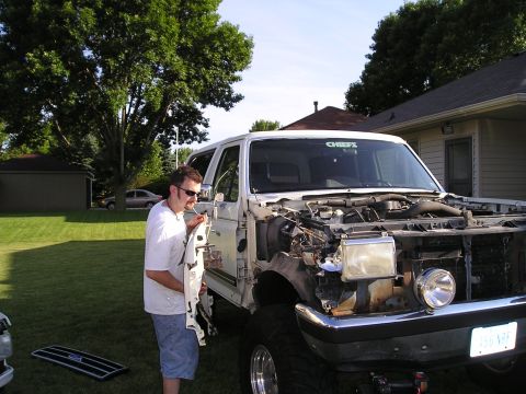1990 Ford Bronco - Remove bracket from rad. support, remove battery and tray, remove start sol., remove wiring harnes and ground, remove two screws behind tur…