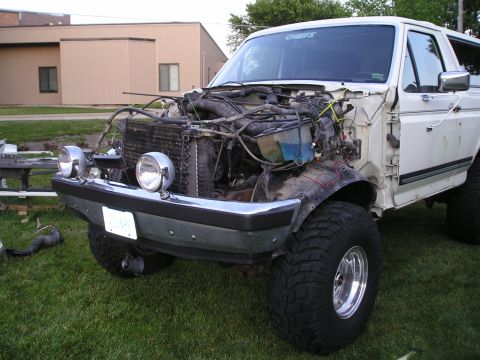 1990 Ford Bronco - next it's the rad supports turn. I left the radiator and condenser connected as well as the tranny cooler. With a little care it can be don…