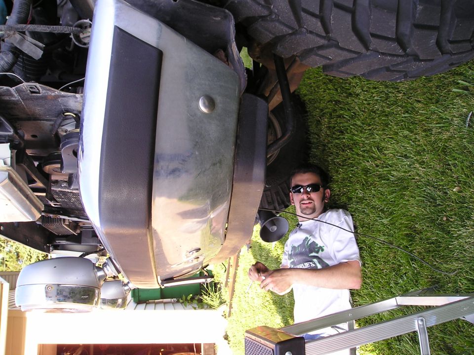unbolt that bumper take it off right at the frame four bolts, don't drop it on your foot.
