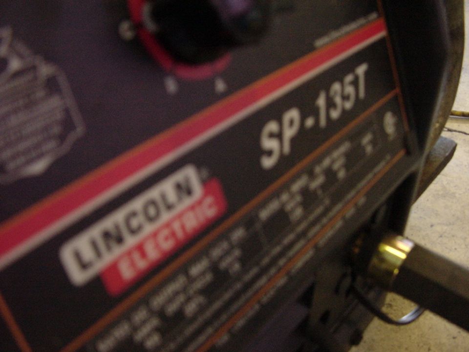 Lincoln Electric SP-135T welder with a dial and some text labels