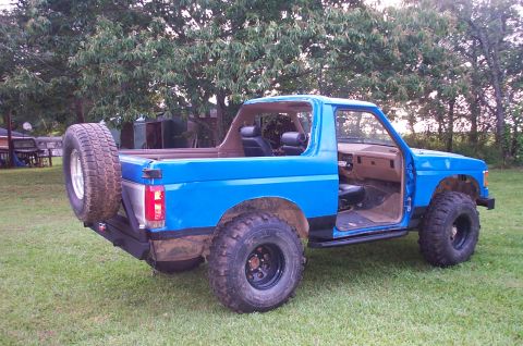 1987 Ford Bronco - This 1987 Ford Bronco is equipped with off-road tires and a rear-mounted spare.
