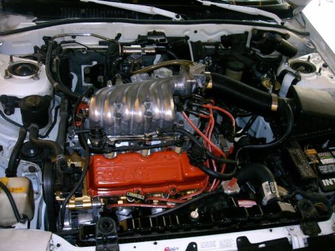 1992 Ford Probe - A view of a V6 engine bay, showing the intake manifold, valve covers, and various engine components.