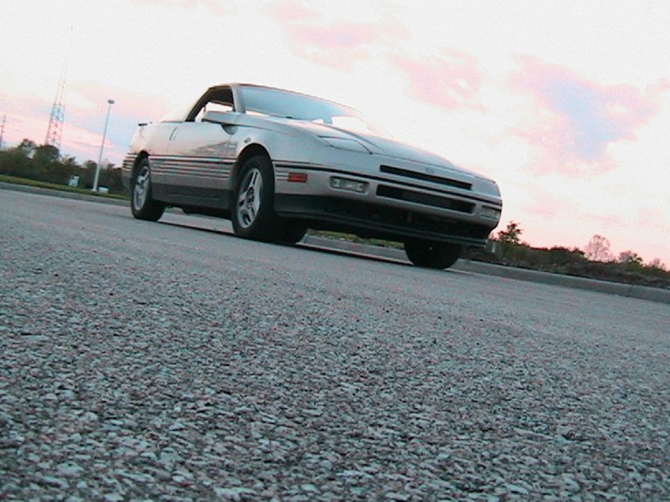 Silver 1989 Ford Probe GT convertible from a low angle