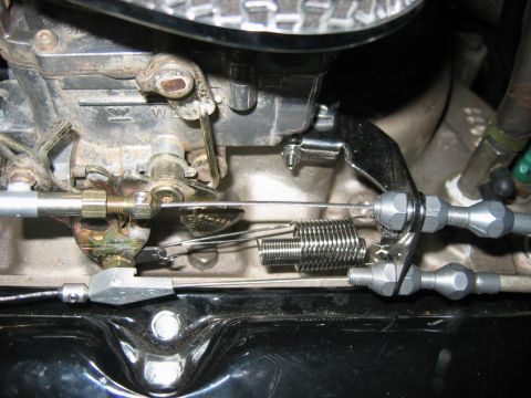 1985 Ford Crown Victoria LTD - Engine compartment detail showing carburetor linkage and associated hardware.