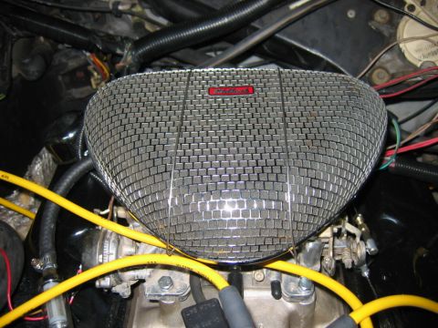 1985 Ford Crown Victoria LTD - Close-up of a chrome Edelbrock air cleaner assembly in an engine bay.
