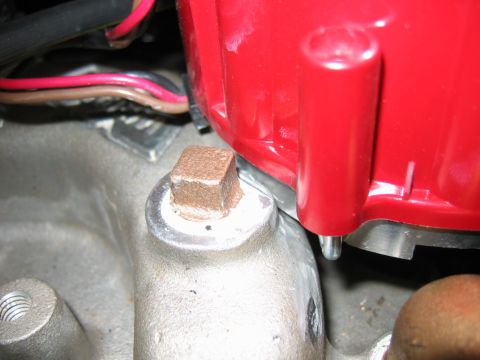 1985 Ford Crown Victoria LTD - A red engine distributor cap with electrical wires is visible in this close-up shot.