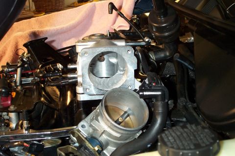 1998 Ford Crown Victoria - Close-up of an engine's intake manifold and throttle body assembly.