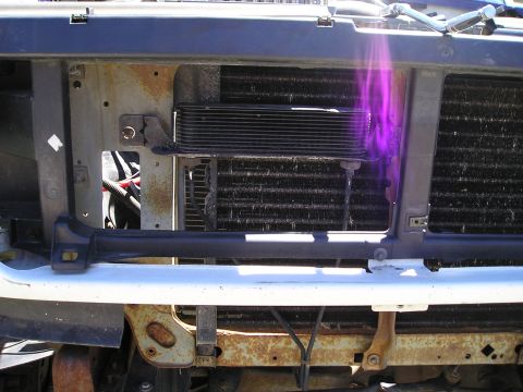 1990 Ford Bronco - cooler condenser brackets and ground strap installed