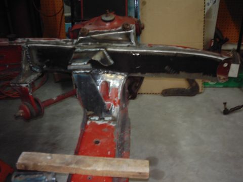 1978 Ford Bronco - This is a close-up view of a heavily modified and welded section of a vehicle's frame.