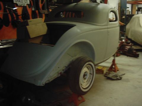1978 Ford Bronco - This vintage coupe body is in a workshop, possibly undergoing restoration, with parts of the interior visible.