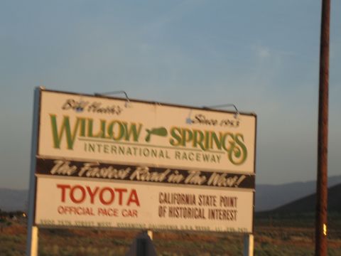1990 Ford Bronco - large sign reading Willow Springs International Raceway, the fastest road in the West, with Toyota official pace car.