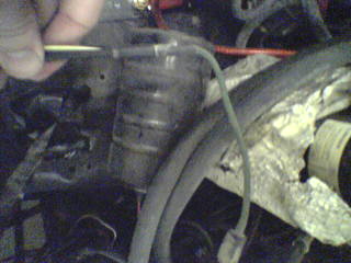1990 Ford Bronco - Detail of alternator wiring, possibly for an upgrade, with a SuperMotors watermark visible.