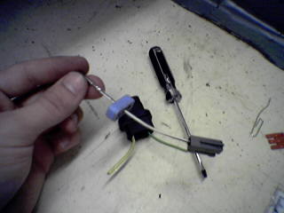 1990 Ford Bronco - Close-up of electrical components and tools, suggesting a repair or upgrade process.