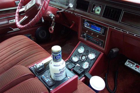 1985 Ford Crown Victoria LTD - Aftermarket gauges and a radio are installed in the center console of this car's interior.