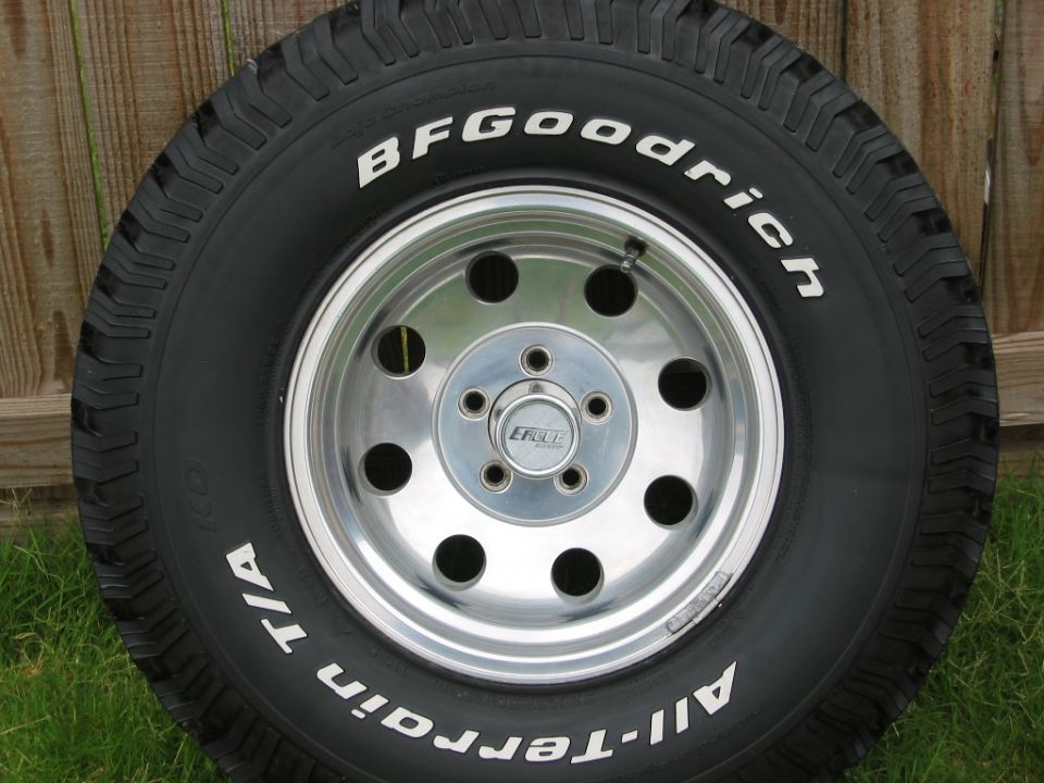 BFGoodrich All-Terrain T/A tire mounted on a chrome 5-lug wheel with an Eagle center cap