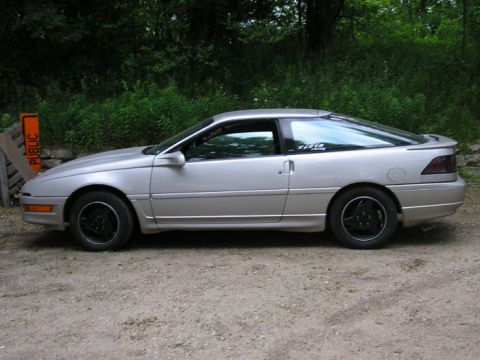 1990 Ford Probe - Side profile of a silver 1990 Ford Probe coupe parked outdoors.