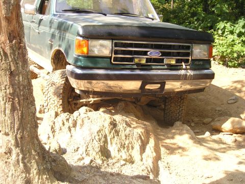 1996 Ford Bronco - This 1996 Ford Bronco tackles a challenging off-road course with its front end angled over rocks.