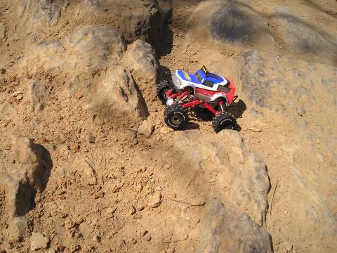 1996 Ford Bronco - A remote control rock crawler navigates a challenging rocky path.