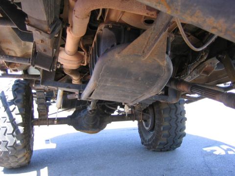 1994 Ford Bronco - This photo shows the undercarriage of a 4x4 vehicle, highlighting its drivetrain and suspension components.